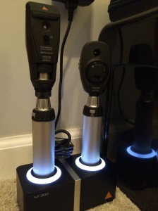 The retinoscope at left and direct ophthalmoscopre at right.